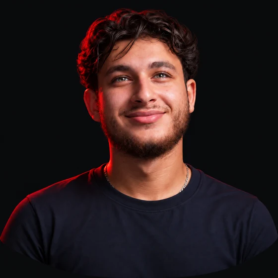 3D-style portrait of Mahdi Yehya, smiling with dark wavy hair and red rim lighting.