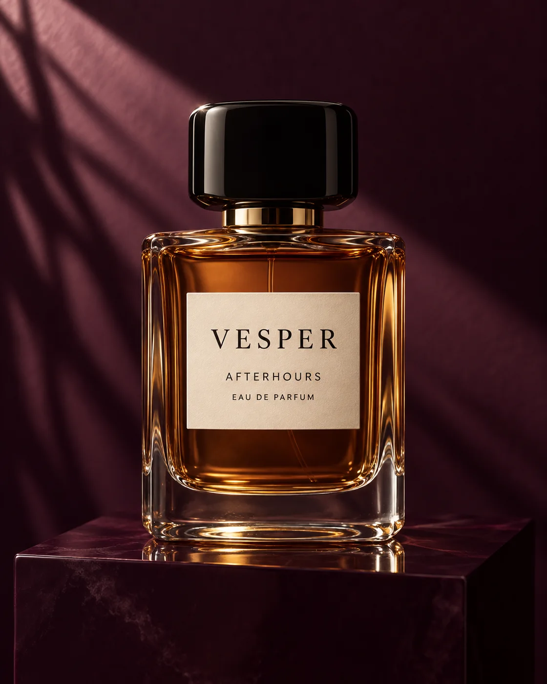 VESPER Afterhours perfume in an amber glass bottle against a burgundy backdrop.